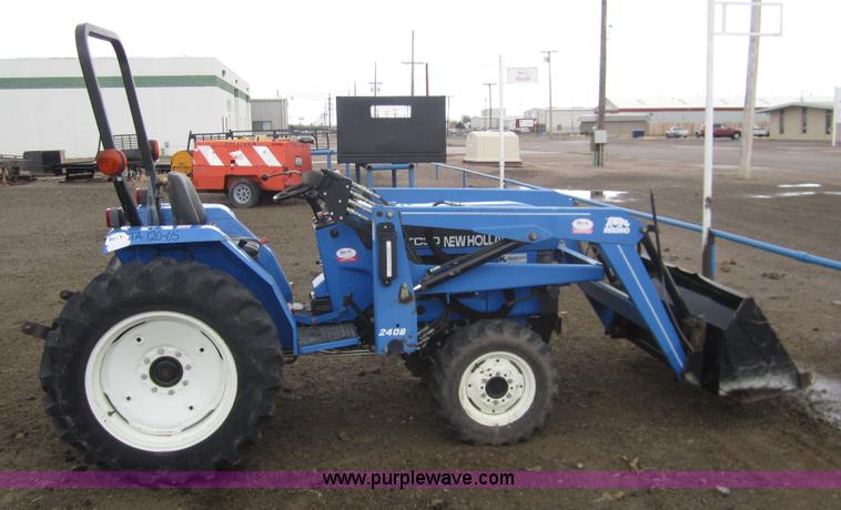image for item 2990 2004 New Holland TC30 MFWD tractor with loader
