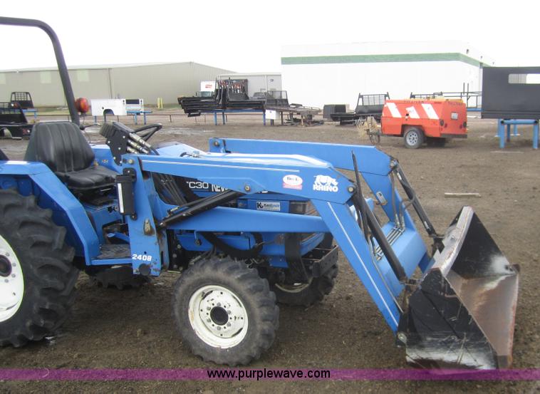 image for item 2990 2004 New Holland TC30 MFWD tractor with loader