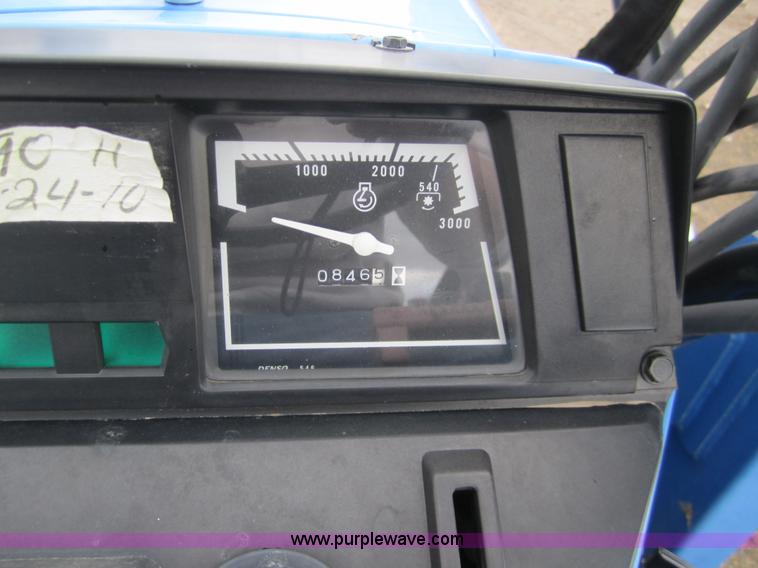 image for item 2990 2004 New Holland TC30 MFWD tractor with loader