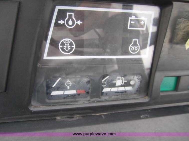 image for item 2990 2004 New Holland TC30 MFWD tractor with loader