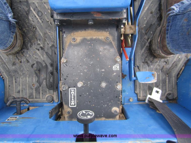 image for item 2990 2004 New Holland TC30 MFWD tractor with loader