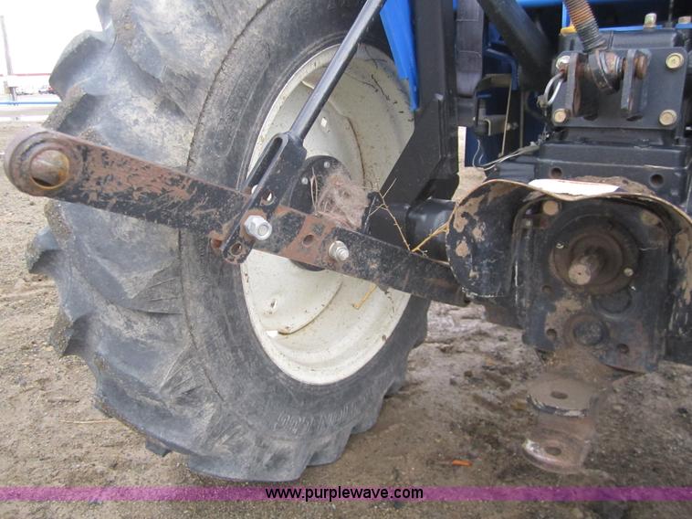 image for item 2990 2004 New Holland TC30 MFWD tractor with loader