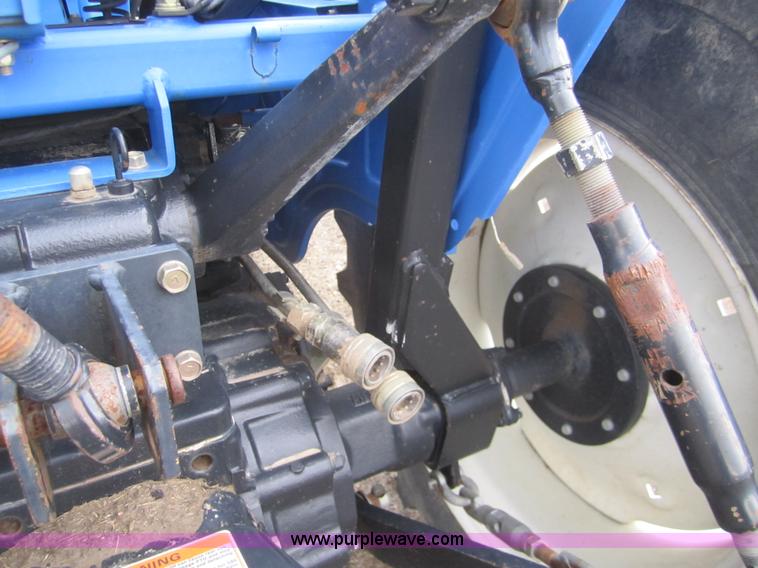 image for item 2990 2004 New Holland TC30 MFWD tractor with loader