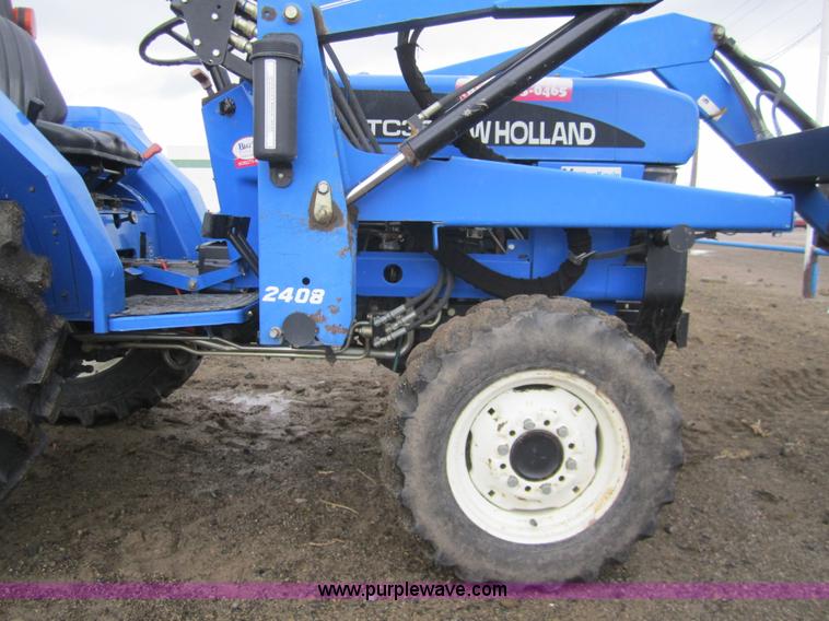 image for item 2990 2004 New Holland TC30 MFWD tractor with loader