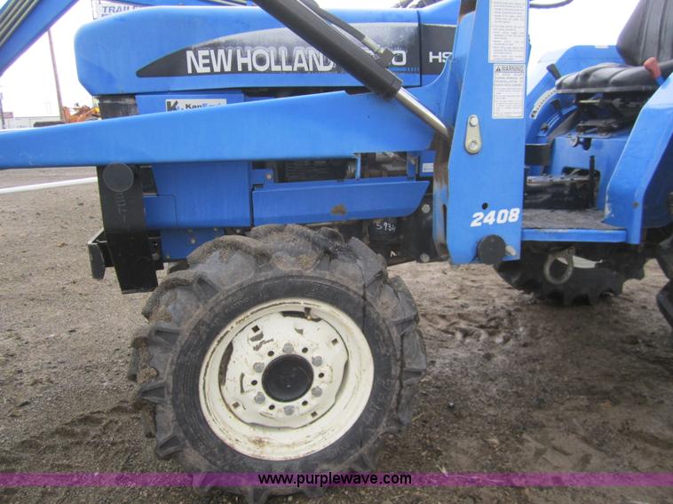 image for item 2990 2004 New Holland TC30 MFWD tractor with loader