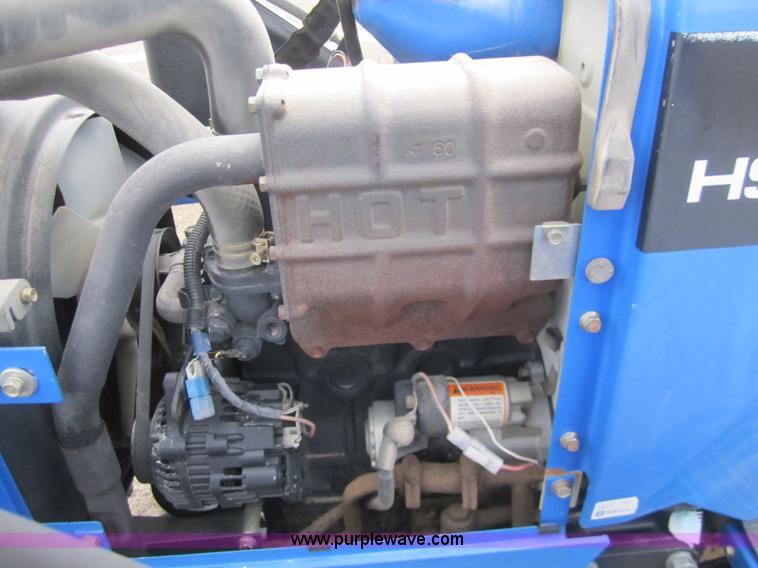 image for item 2990 2004 New Holland TC30 MFWD tractor with loader