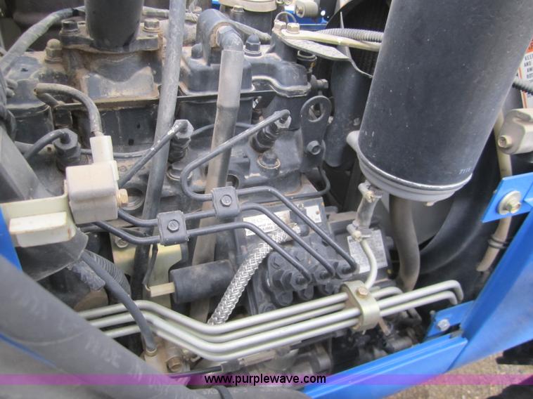 image for item 2990 2004 New Holland TC30 MFWD tractor with loader