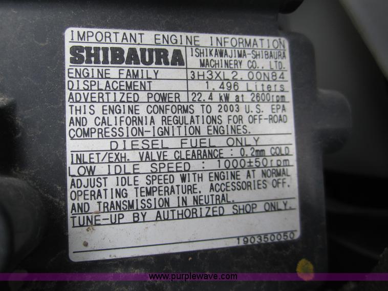 image for item 2990 2004 New Holland TC30 MFWD tractor with loader