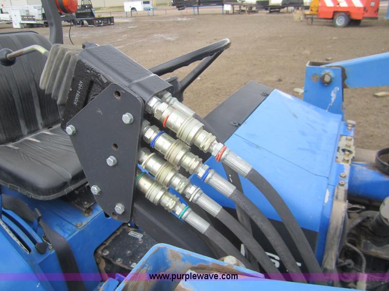 image for item 2990 2004 New Holland TC30 MFWD tractor with loader