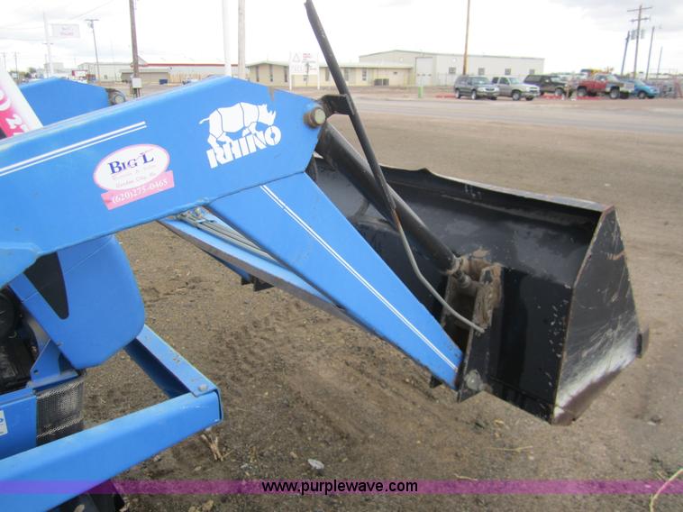 image for item 2990 2004 New Holland TC30 MFWD tractor with loader