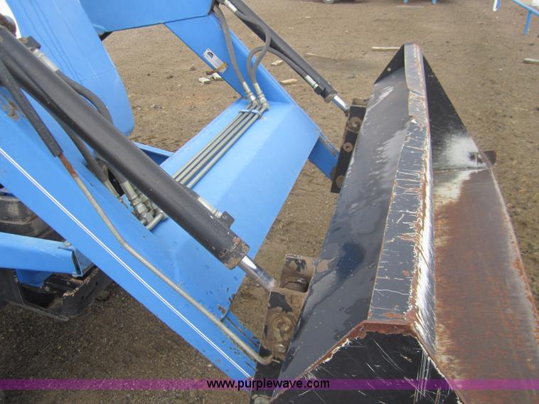 image for item 2990 2004 New Holland TC30 MFWD tractor with loader