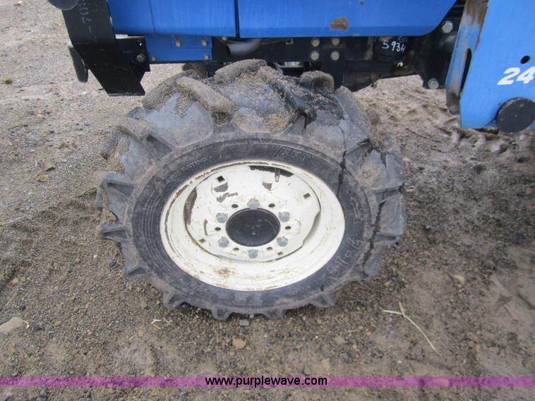 image for item 2990 2004 New Holland TC30 MFWD tractor with loader