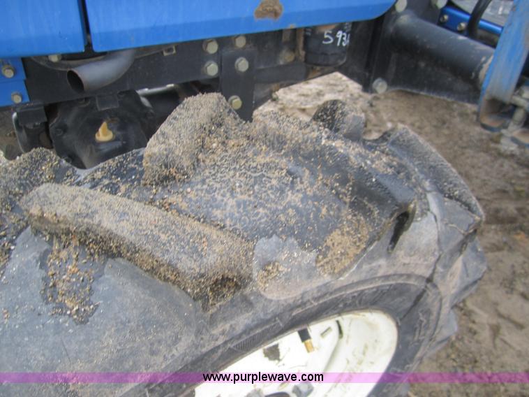 image for item 2990 2004 New Holland TC30 MFWD tractor with loader