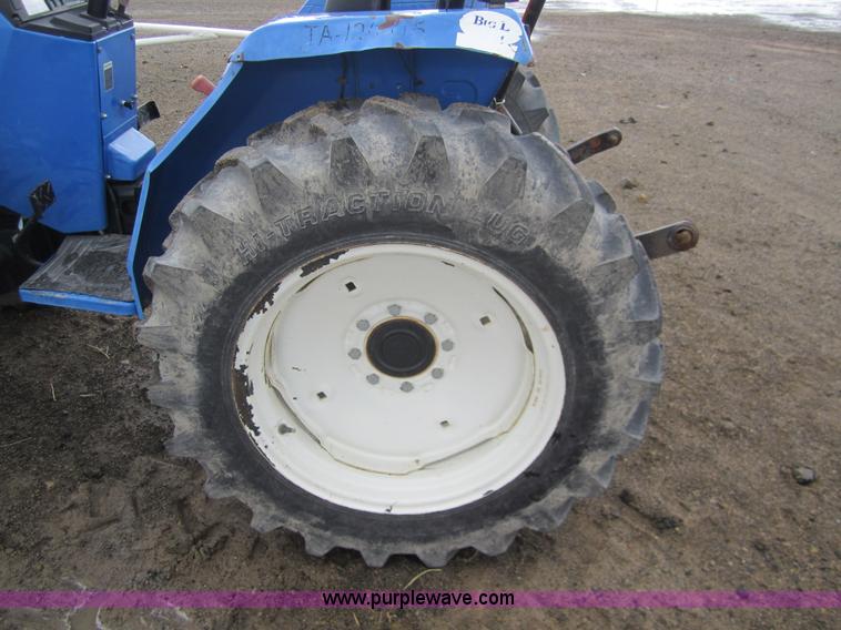 image for item 2990 2004 New Holland TC30 MFWD tractor with loader