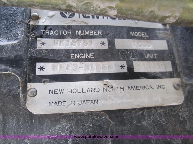 image for item 2990 2004 New Holland TC30 MFWD tractor with loader