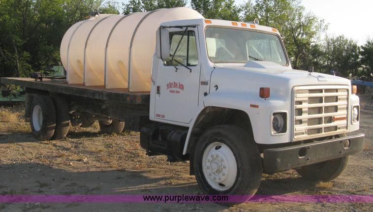 image for item 8060 1987 International S1955 flatbed tender truck