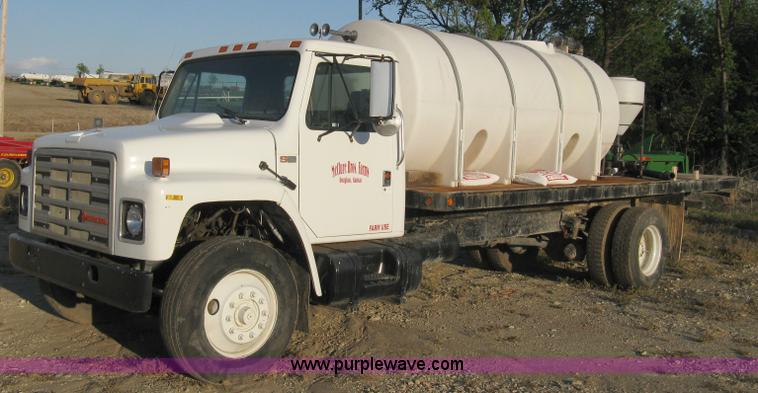 image for item 8060 1987 International S1955 flatbed tender truck
