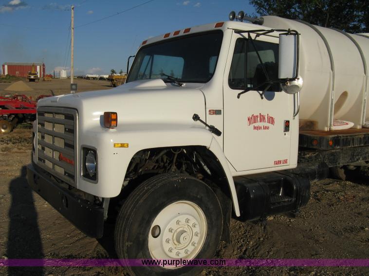 image for item 8060 1987 International S1955 flatbed tender truck