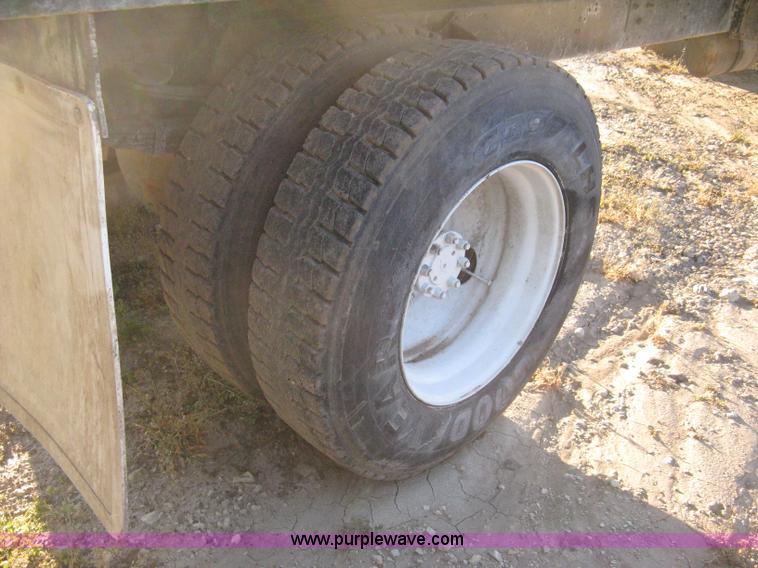 image for item 8060 1987 International S1955 flatbed tender truck