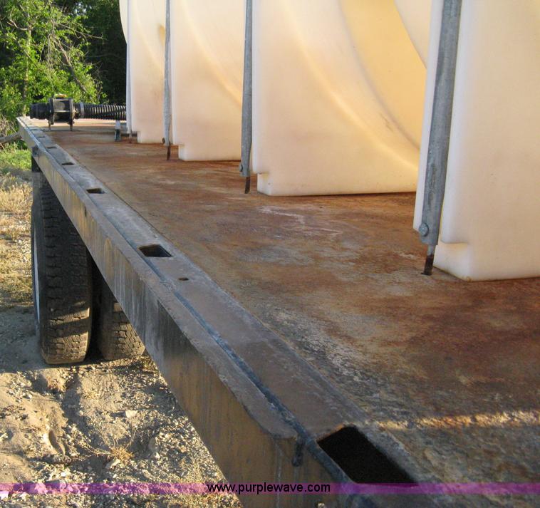 image for item 8060 1987 International S1955 flatbed tender truck