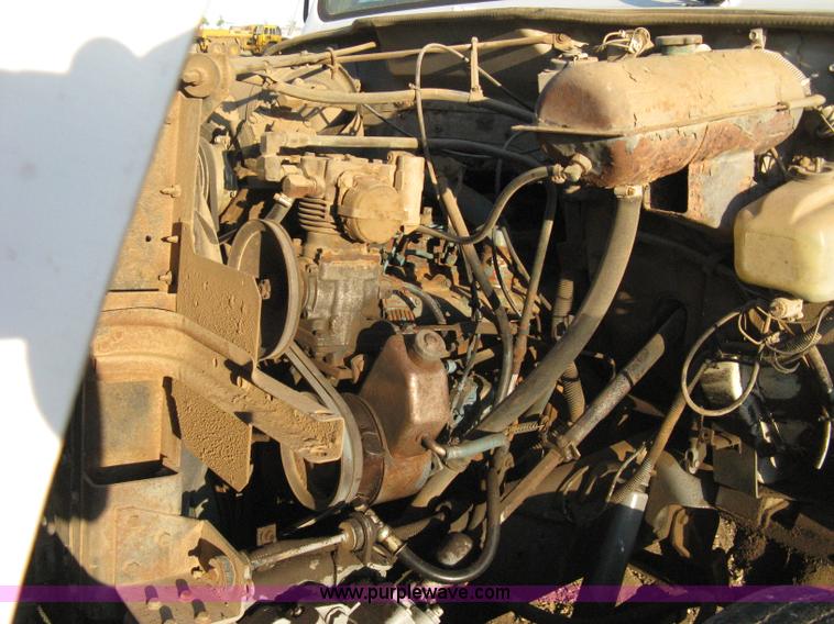 image for item 8060 1987 International S1955 flatbed tender truck