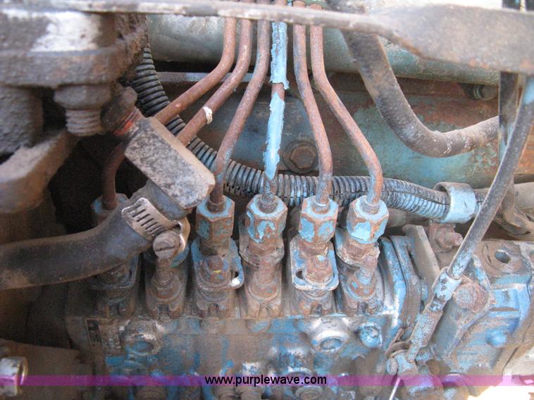 image for item 8060 1987 International S1955 flatbed tender truck