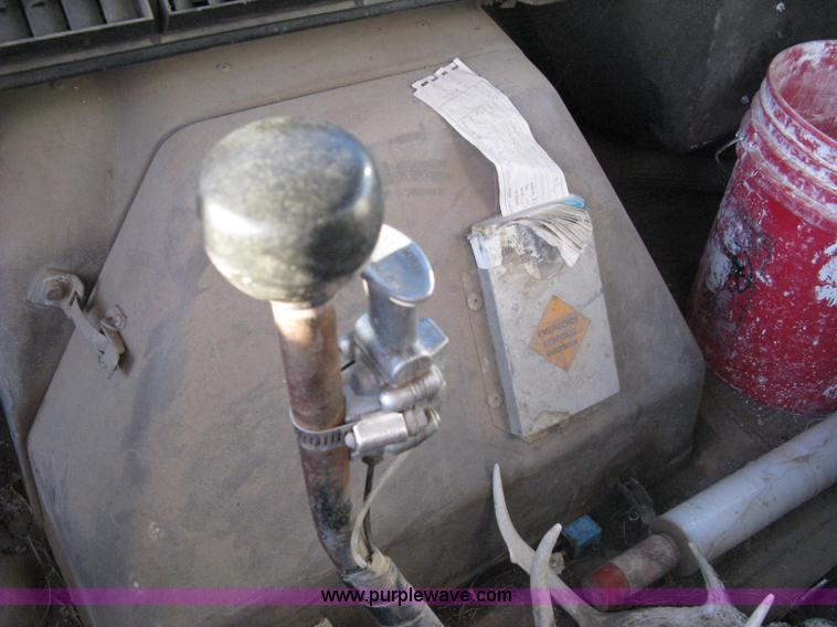 image for item 8060 1987 International S1955 flatbed tender truck