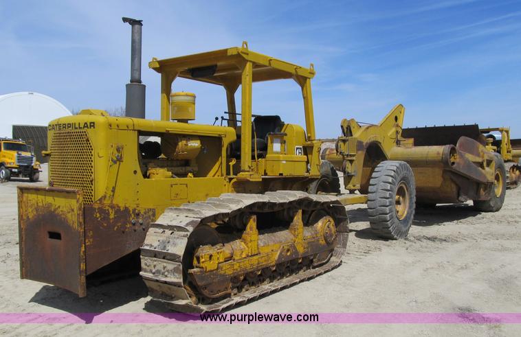 image for item 4144 1976 Caterpillar D6C dozer with towed scraper