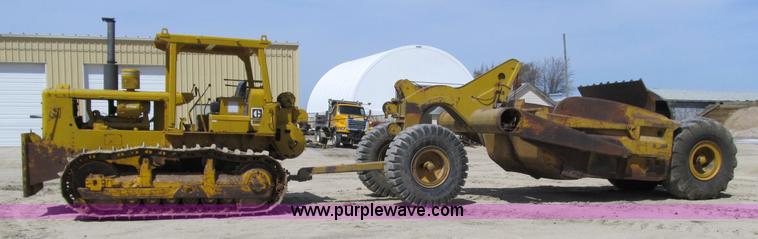 image for item 4144 1976 Caterpillar D6C dozer with towed scraper