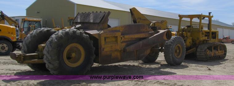 image for item 4144 1976 Caterpillar D6C dozer with towed scraper