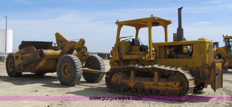 image for item 4144 1976 Caterpillar D6C dozer with towed scraper
