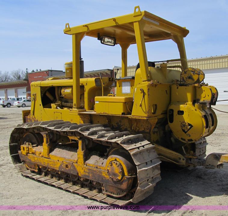 image for item 4144 1976 Caterpillar D6C dozer with towed scraper