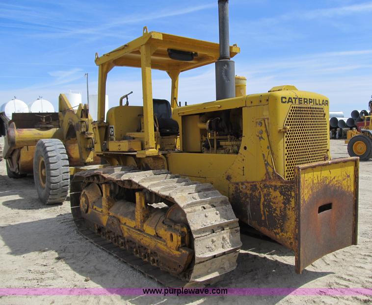 image for item 4144 1976 Caterpillar D6C dozer with towed scraper