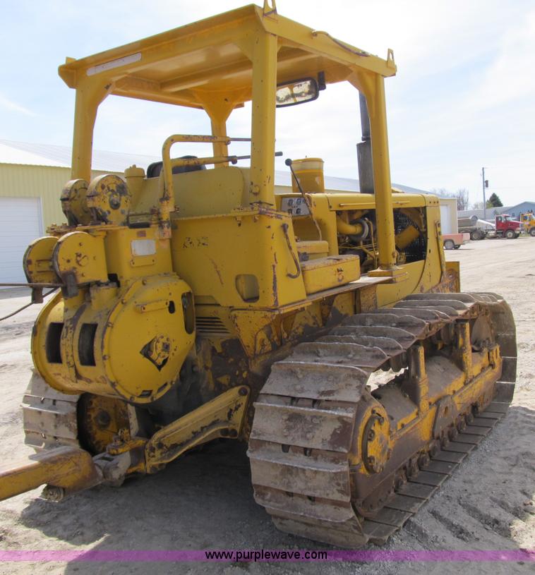 image for item 4144 1976 Caterpillar D6C dozer with towed scraper
