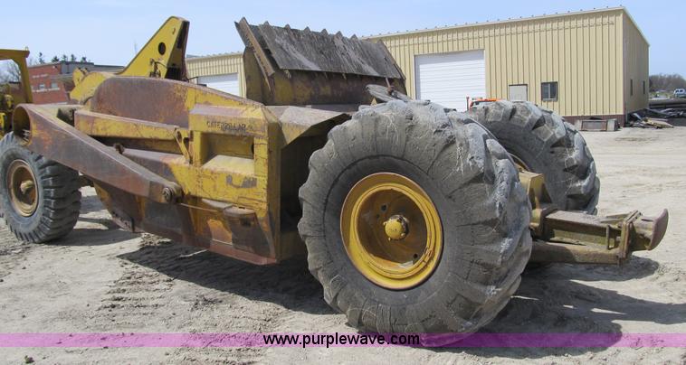 image for item 4144 1976 Caterpillar D6C dozer with towed scraper