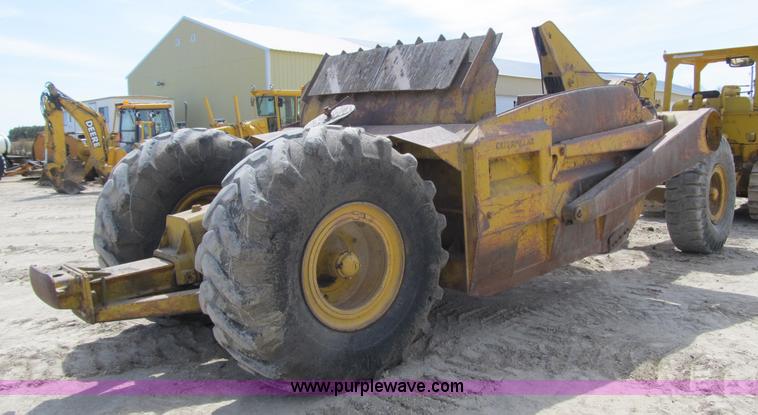 image for item 4144 1976 Caterpillar D6C dozer with towed scraper