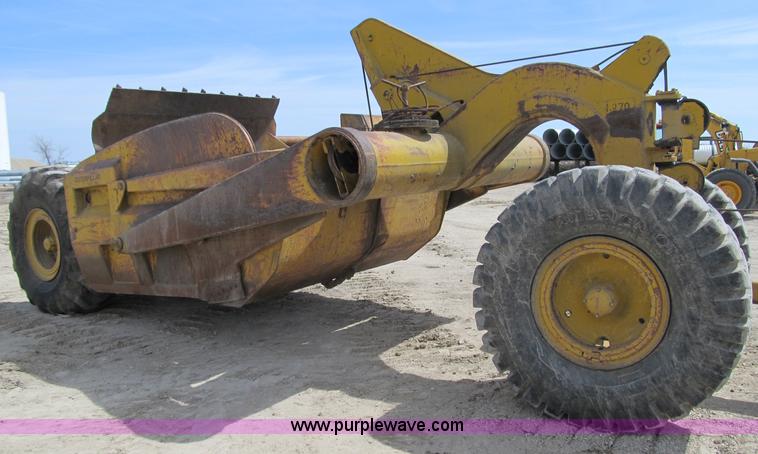 image for item 4144 1976 Caterpillar D6C dozer with towed scraper