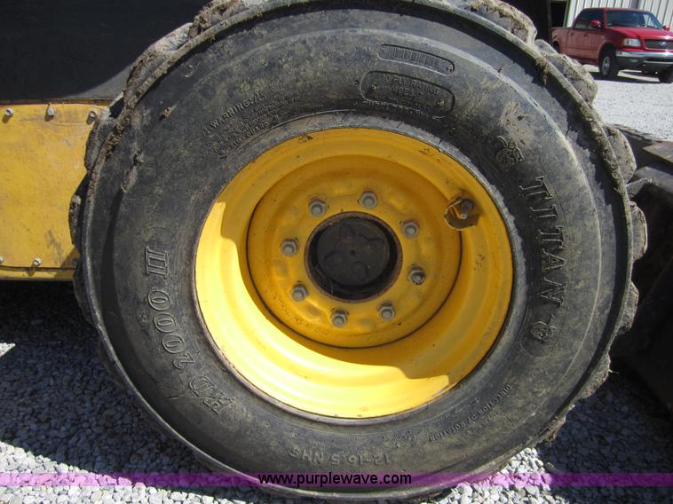 image for item 4386 2007 New Holland L190 skid steer super boom