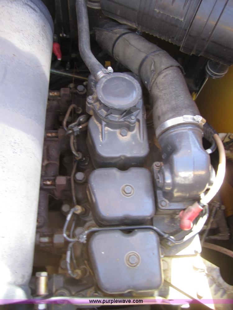 image for item 4386 2007 New Holland L190 skid steer super boom