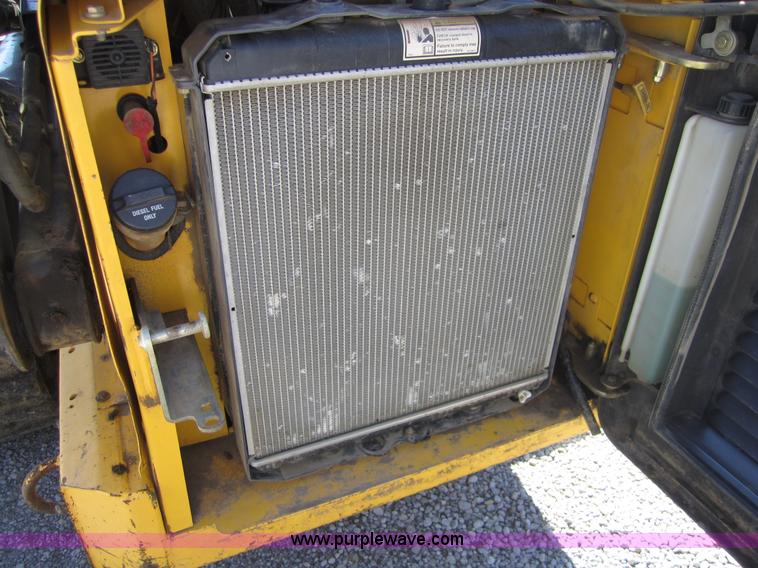 image for item 4386 2007 New Holland L190 skid steer super boom