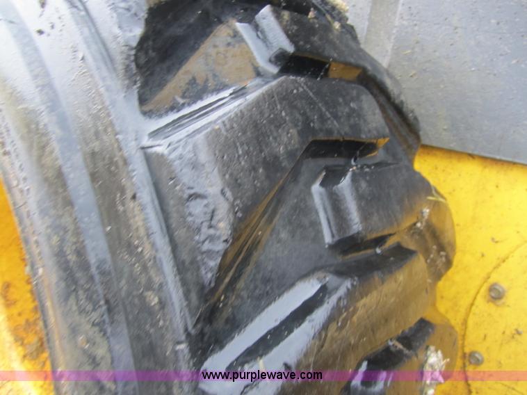 image for item 4386 2007 New Holland L190 skid steer super boom