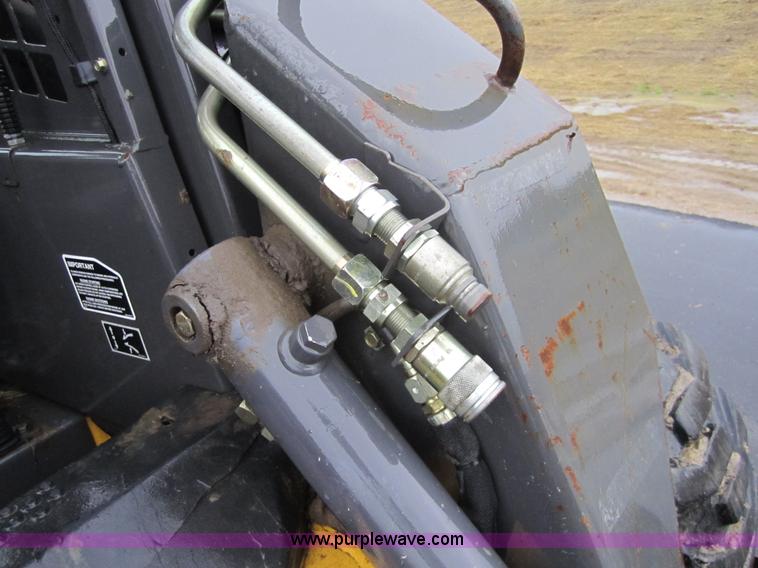 image for item 4386 2007 New Holland L190 skid steer super boom