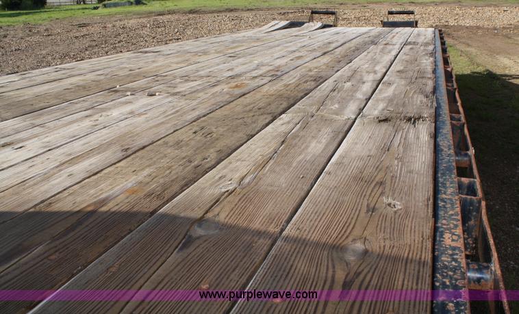 image for item 4723 2004 Blue Diamond goose neck flatbed trailer