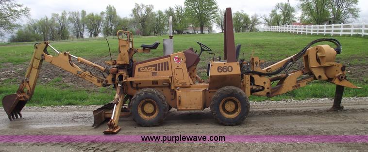 image for item 5437 Case 660 hoe and offset cable plow