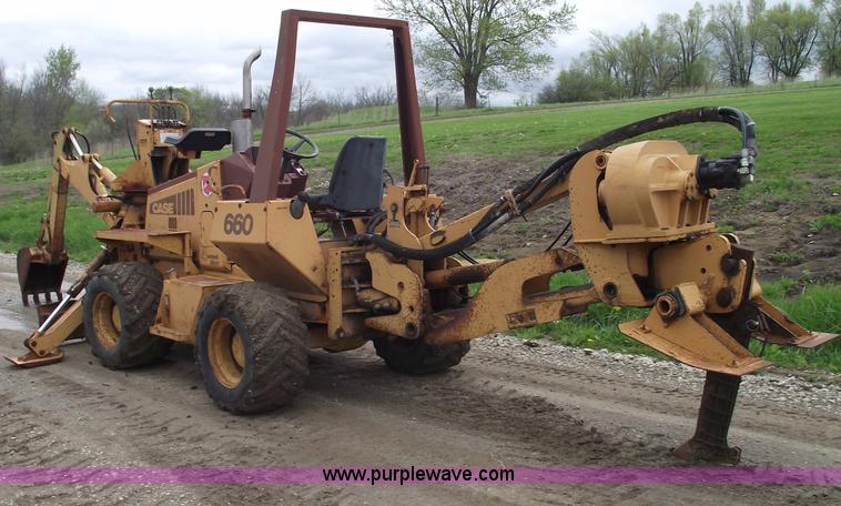 image for item 5437 Case 660 hoe and offset cable plow