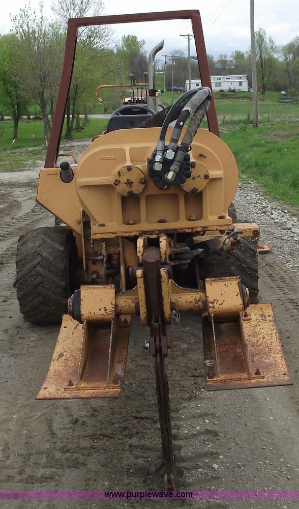 image for item 5437 Case 660 hoe and offset cable plow