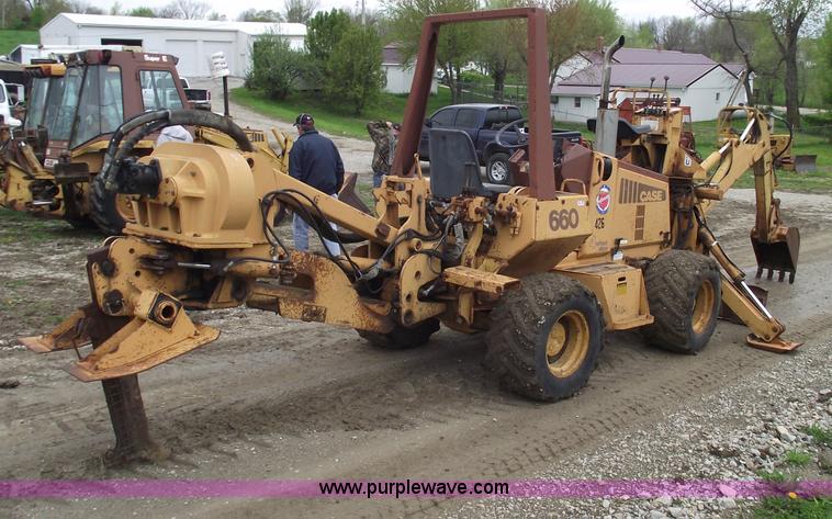 image for item 5437 Case 660 hoe and offset cable plow
