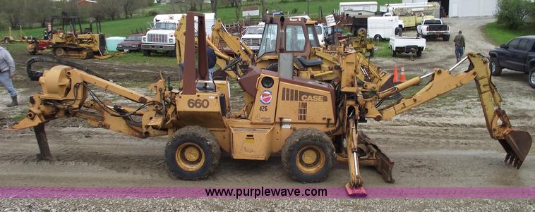 image for item 5437 Case 660 hoe and offset cable plow