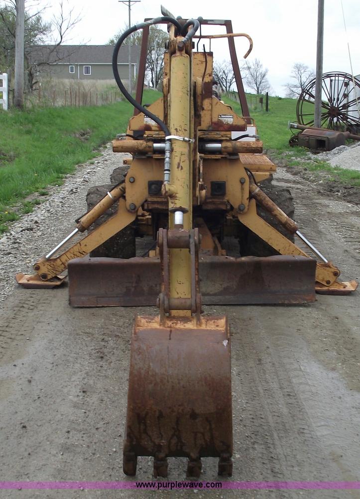 image for item 5437 Case 660 hoe and offset cable plow
