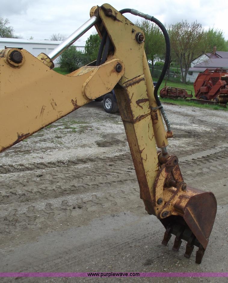 image for item 5437 Case 660 hoe and offset cable plow